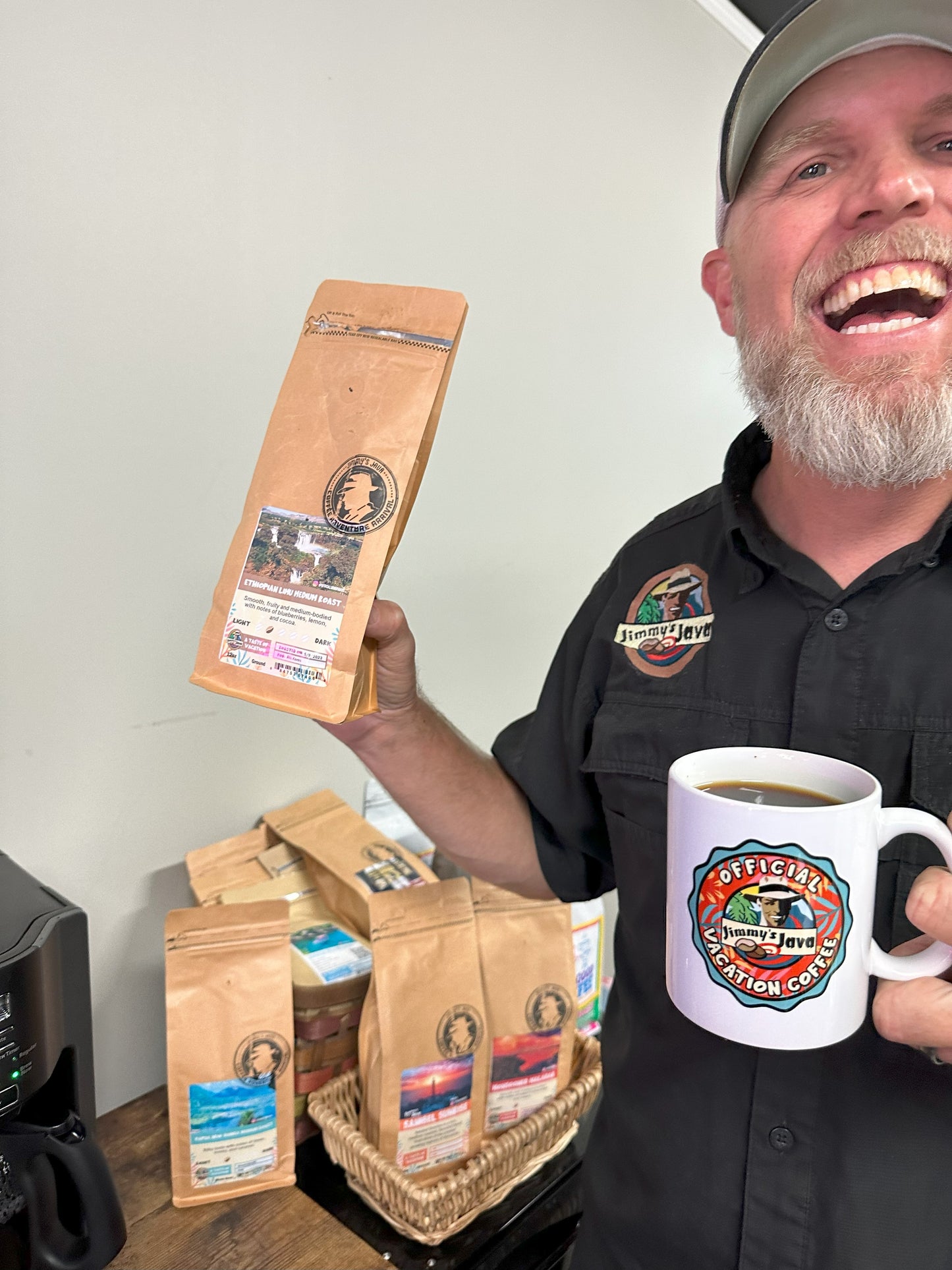 ric holding a bag of ethiopian coffee from jimmys java
